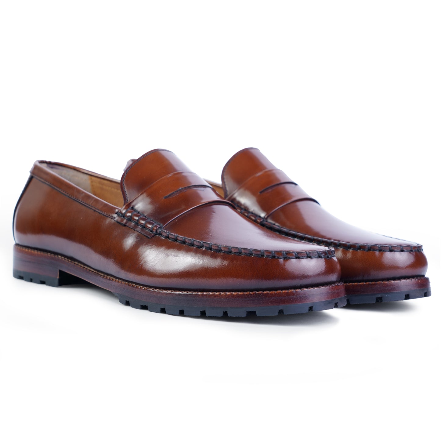 Side view of Brown colour Round toe Penny loafer formal shoes in leather with Blake stitched leather sole
